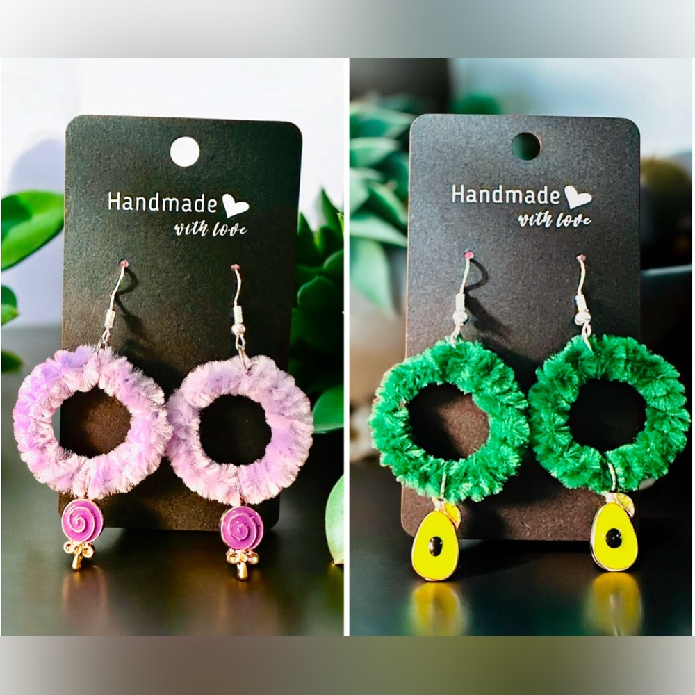 Two hoop earrings with lollipop charm